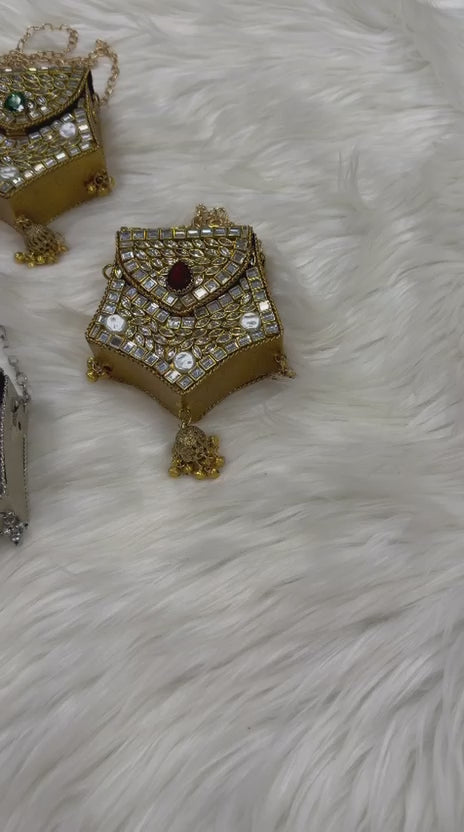Hanging jhumka-inspired tassel detail on a traditional potli