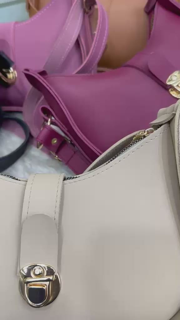 Stylish hobo shoulder bag with front lock detail